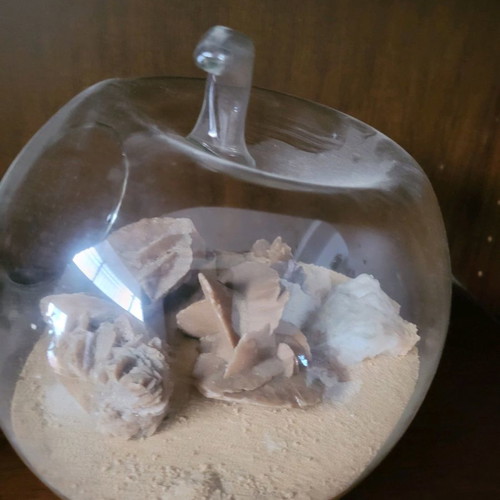 Desert rose used with agate and amethyst in glass bowl