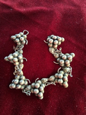 Silver bracelet used with grape motif missing clasp
