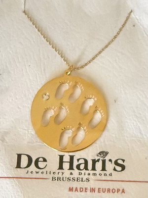 Pendant with four baby feet, gold color