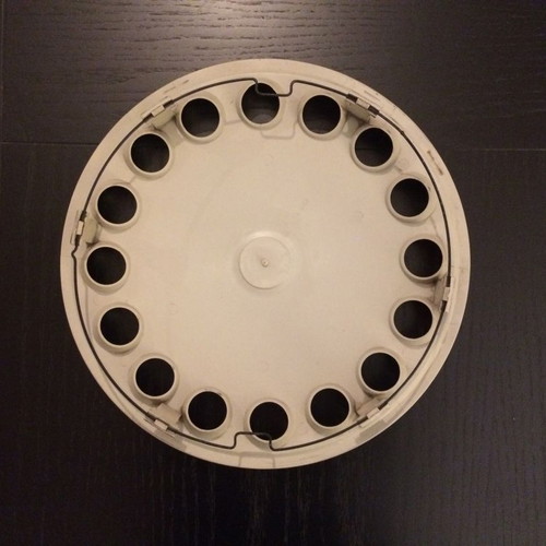 Alfa Romeo 75 hubcap used with scratches and marks