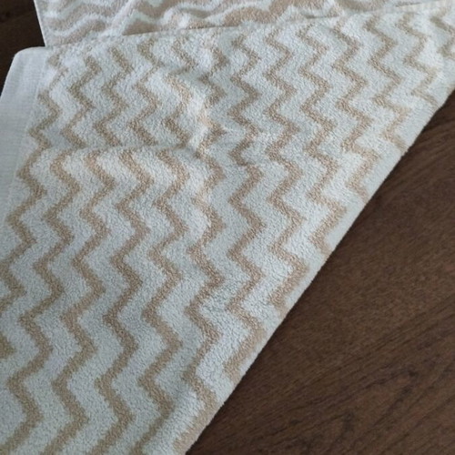 Laura Ashley face towel like new with geometric pattern light blue beige