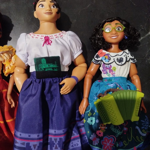 Disney Store Encanto dolls like new, all together