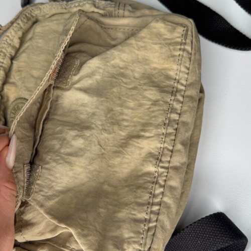 Kipling beige crossbody bag used with multiple compartments and strap