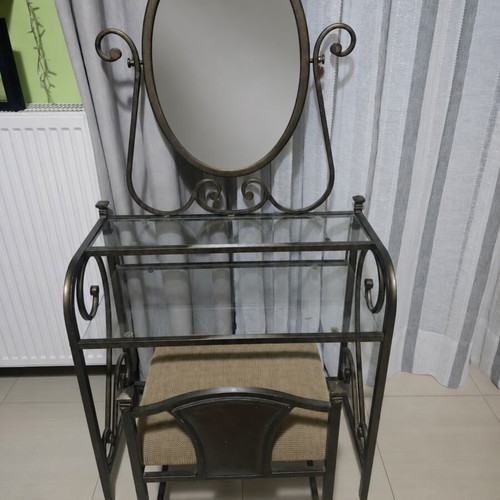 Metal Boudoir vanity table with swivel oval mirror and stool used
