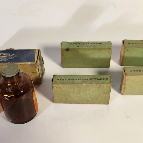 Antique staplers and two used bottles for decoration