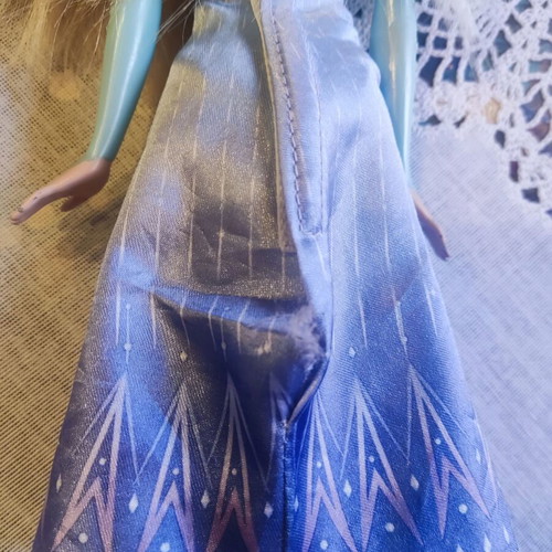 Elsa doll used with skirt tear