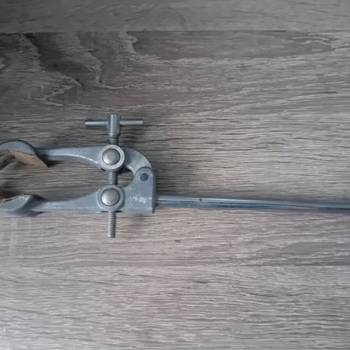 Old laboratory tools used for holding test tubes and bottles