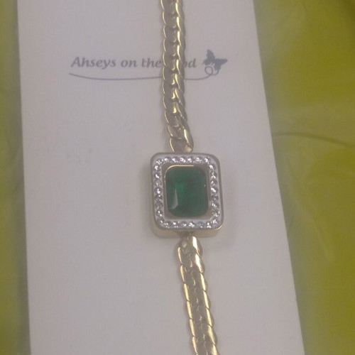 Jewelry set made of steel new with green and gold stones