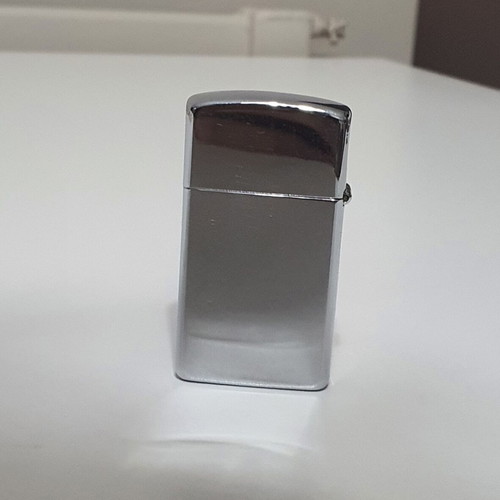 Zippo lighter used small size with engraved design