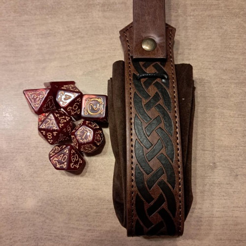 Runic leather dice bag with red D&D dragon dice set