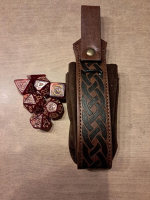 Runic leather dice bag with red D&D dragon dice set