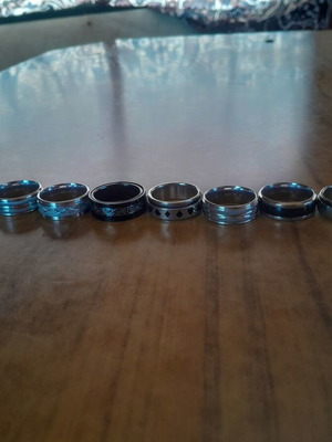 Rings medium size, black and silver, like new, set of 10
