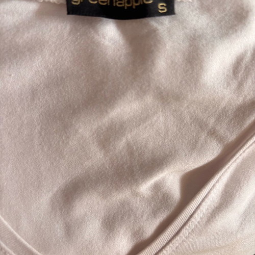 Women's white short-sleeve blouse with razor blade design, size S used
