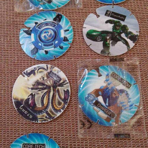 Cheetos Monsuno and Transformers collectible caps, pack of 7, new