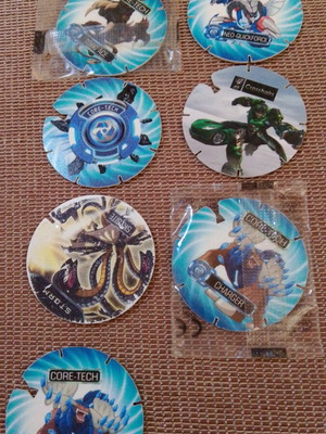 Cheetos Monsuno and Transformers collectible caps, pack of 7, new
