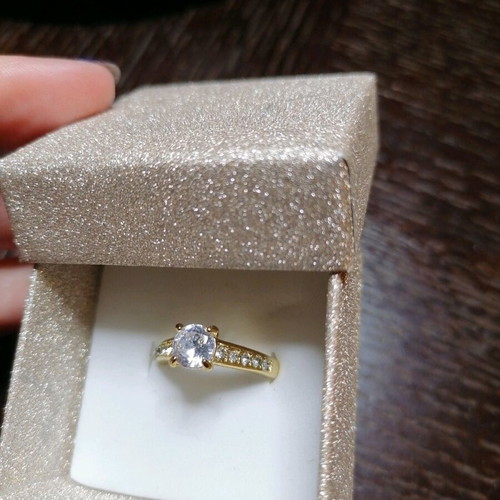 Steel solitaire ring new, gold color