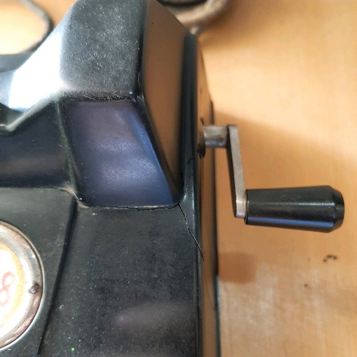 Antique telephone with crank used, 1920-30