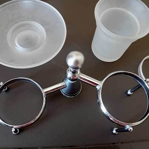 Two sets of inox bathroom accessories with glass and frosted parts