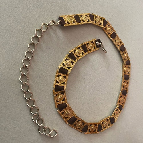Belt with golden metal details on brown leather, like new