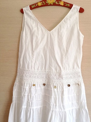 Long white dress used with lace and fake coins