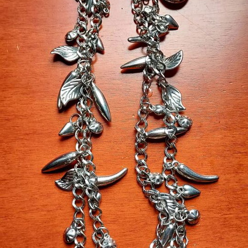 Silver Charm Necklace like new, long with leaf and drop pendants