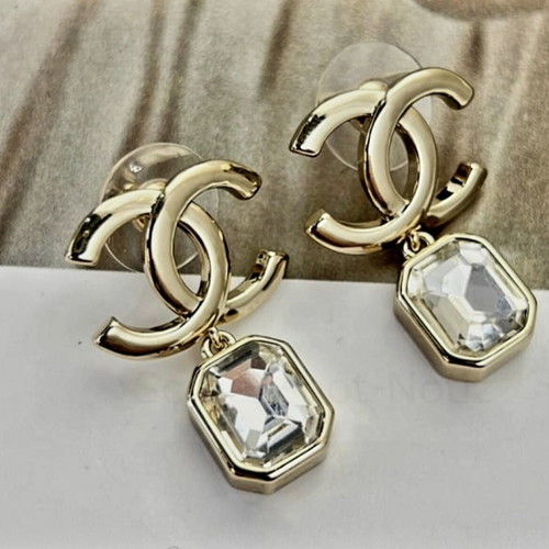 Chanel earrings with white and gold details