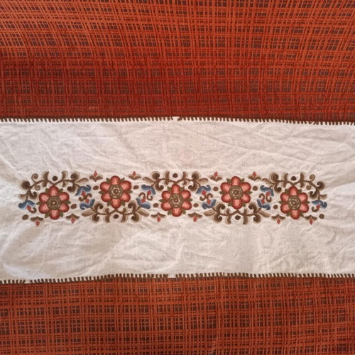 Traditional embroidered table runner like new with floral motifs