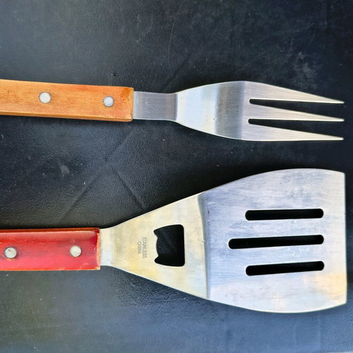 Barbecue set used with stainless steel fork and spatula with wooden handles