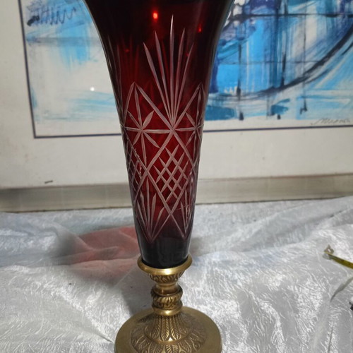 Vintage red glass vase with cut designs and decorative brass base and rim