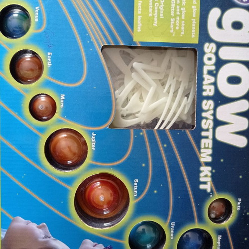 Educational toy used with solar system and glow-in-the-dark stars