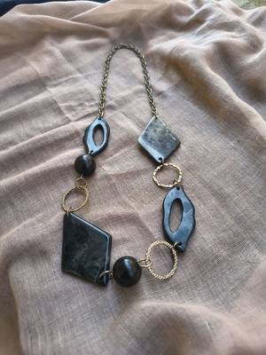 Necklace with black elements like new, modern statement jewelry