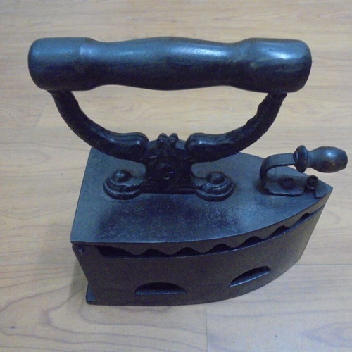 Antique charcoal iron restored with internal grill
