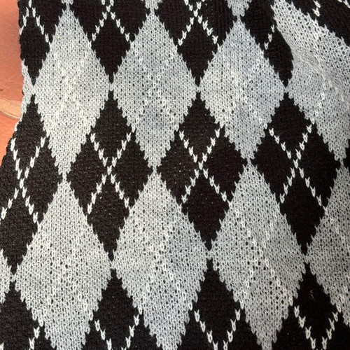 Showing sleeveless ski pullover checkered size small