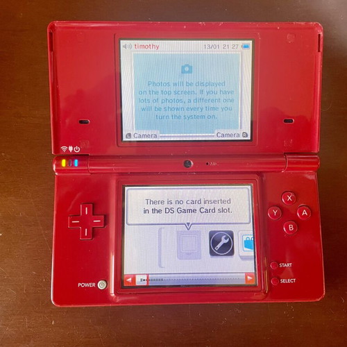 Nintendo DSi console with charger, stylus and memory card