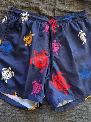 American Stars swim shorts size M like new, blue with turtle print