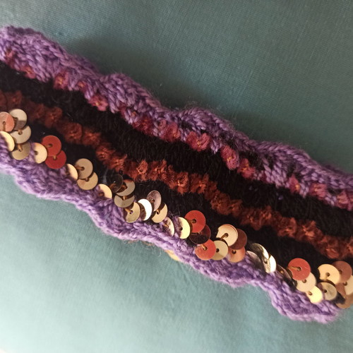 Boho knitted bracelet like new with purple and gold sequins