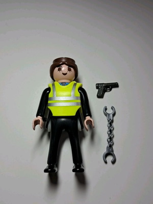 Playmobil φιγούρα αστυνομικού με κίτρινο γιλέκο, πιστόλι και χειροπέδες