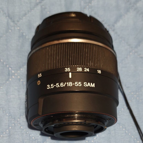 Sony A500 camera used with two lenses, battery, SD card, and carrying case