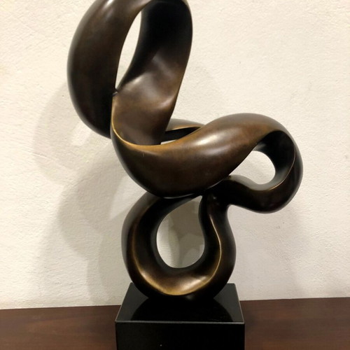 Modern sculpture used on black base, height 62cm