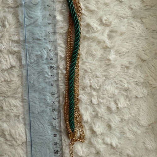 Steel bracelet new with green cord braided design