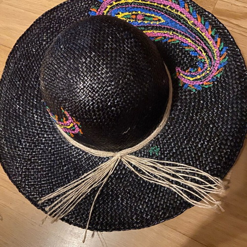 Painted hat on black background new for distinctive ladies