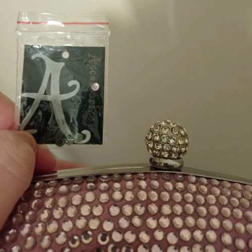 Accessorize pink clutch bag
