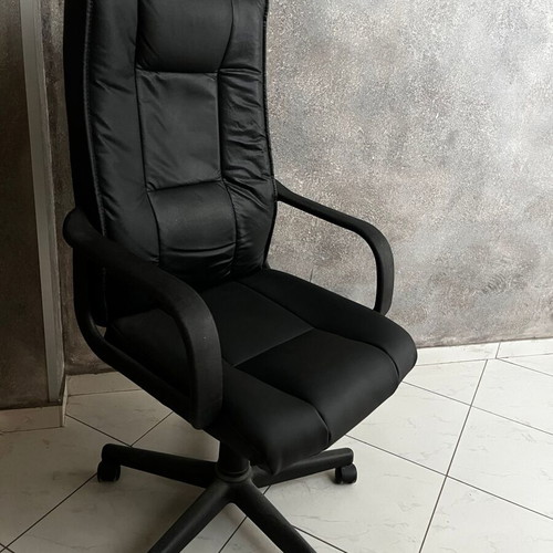 Black executive office chair with armrests and wheels