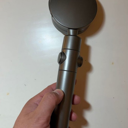 Modern shower head with stop button and flow selector, gunmetal