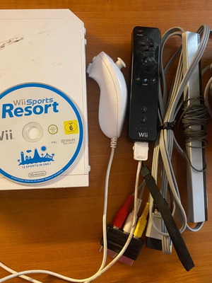 Nintendo Wii used with Wii Sports Resort game and accessories in moderate condition