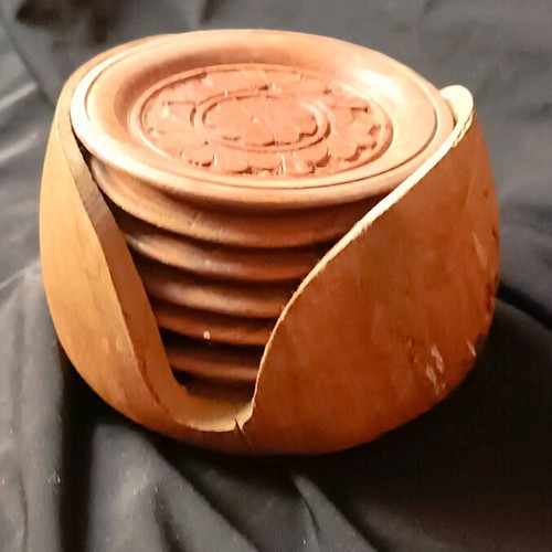 Wooden vintage hand-carved coasters used