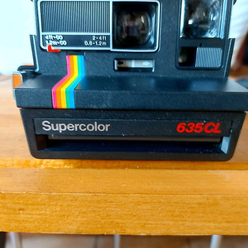 Polaroid Supercolor 635CL vintage instant camera used with strap