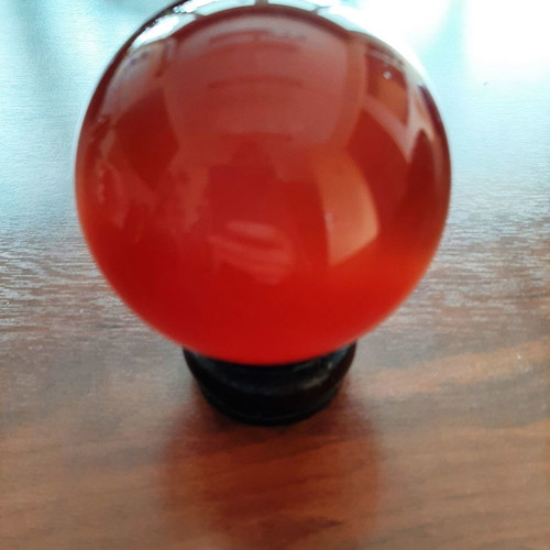 Indian crystal sphere red color on wooden base new