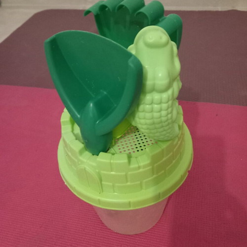 Children's beach bucket set used with shovel, rake and crocodile mold