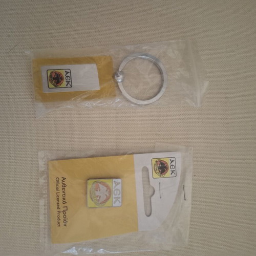 AEK pin and keychain new, authentic collectible